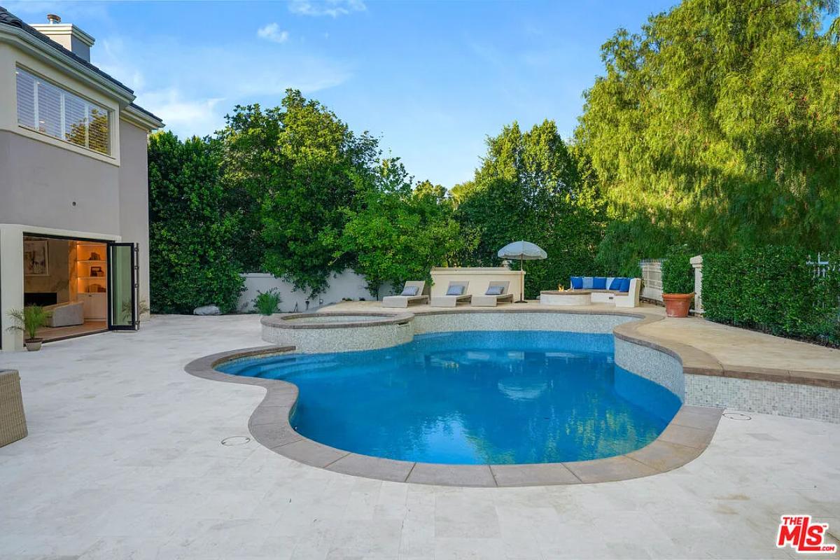 Pool with lounge chairs.