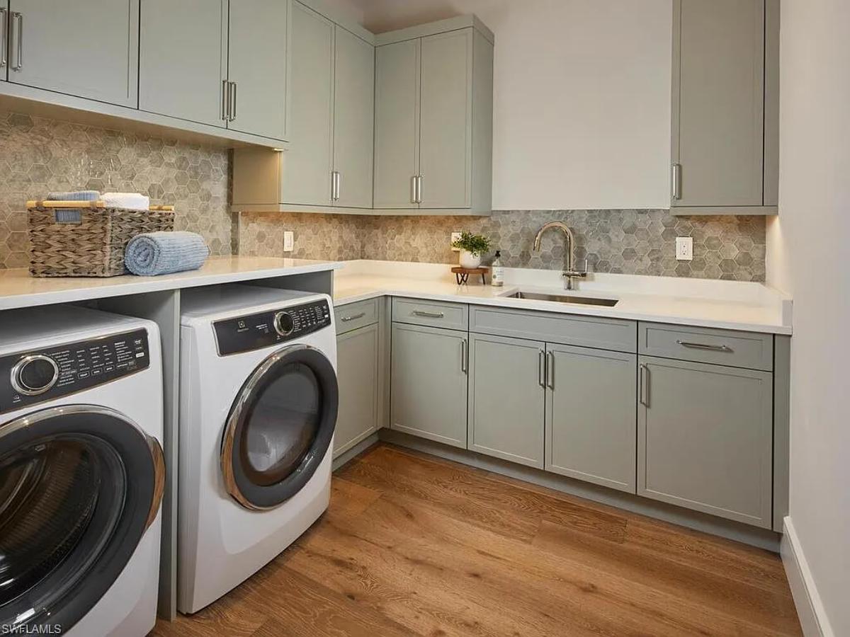 Laundry room with custom cabinetry.