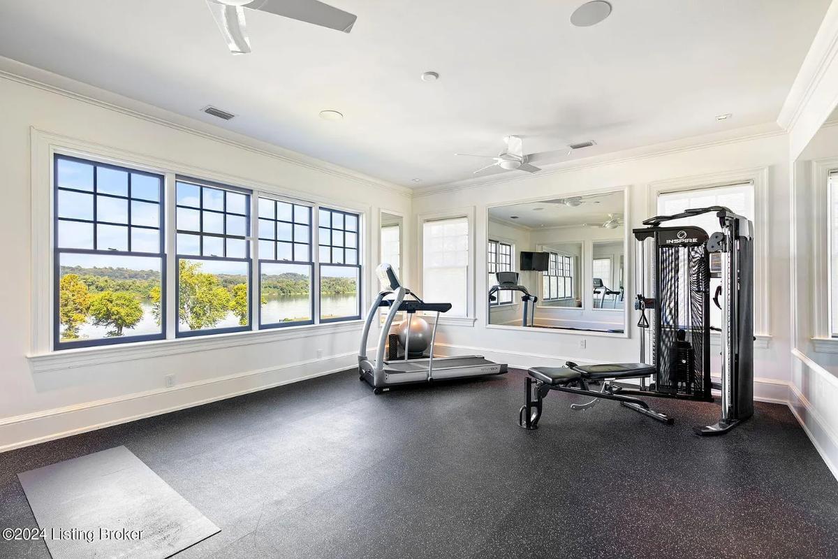 Home gym with glass windows.