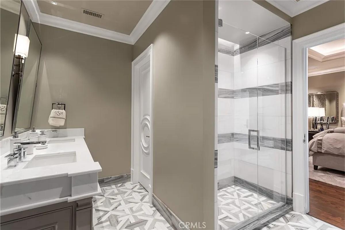 Bathroom with a sink and a walk-in shower.