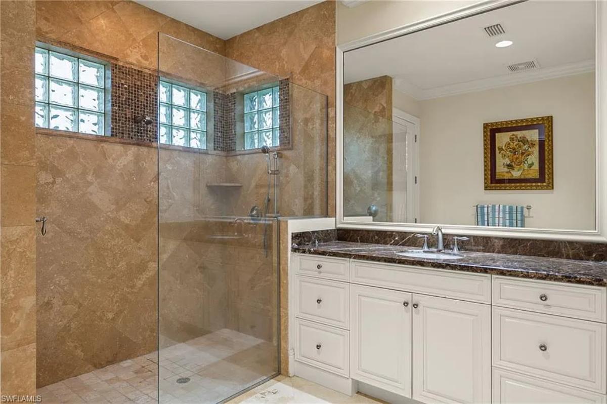 Bathroom with a sink and a walk-in shower.