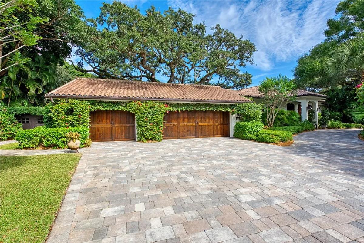 Garage with a spacious driveway.