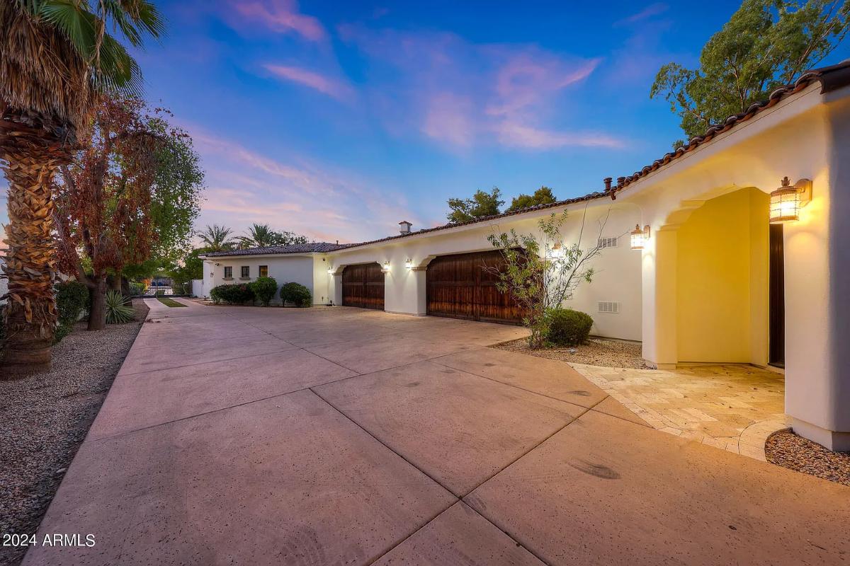 Garage with spacious driveway.