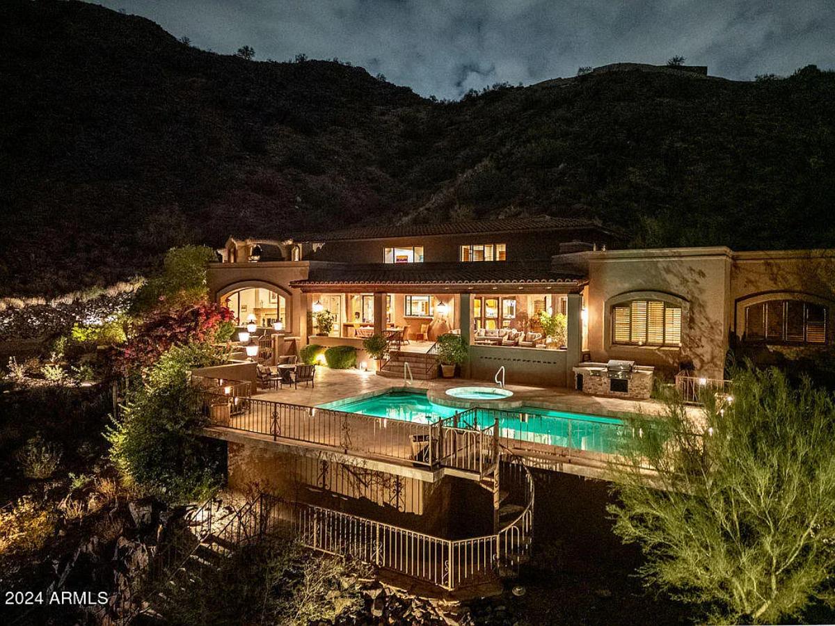 Rear view of the mansion with a pool.