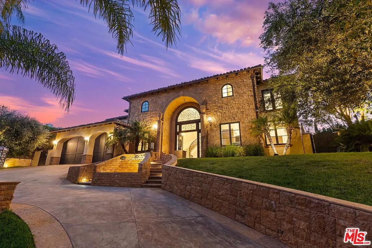 Front view of the mansion with a garage.