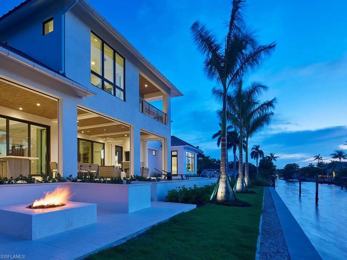 Backyard of the mansion with a fire pit.
