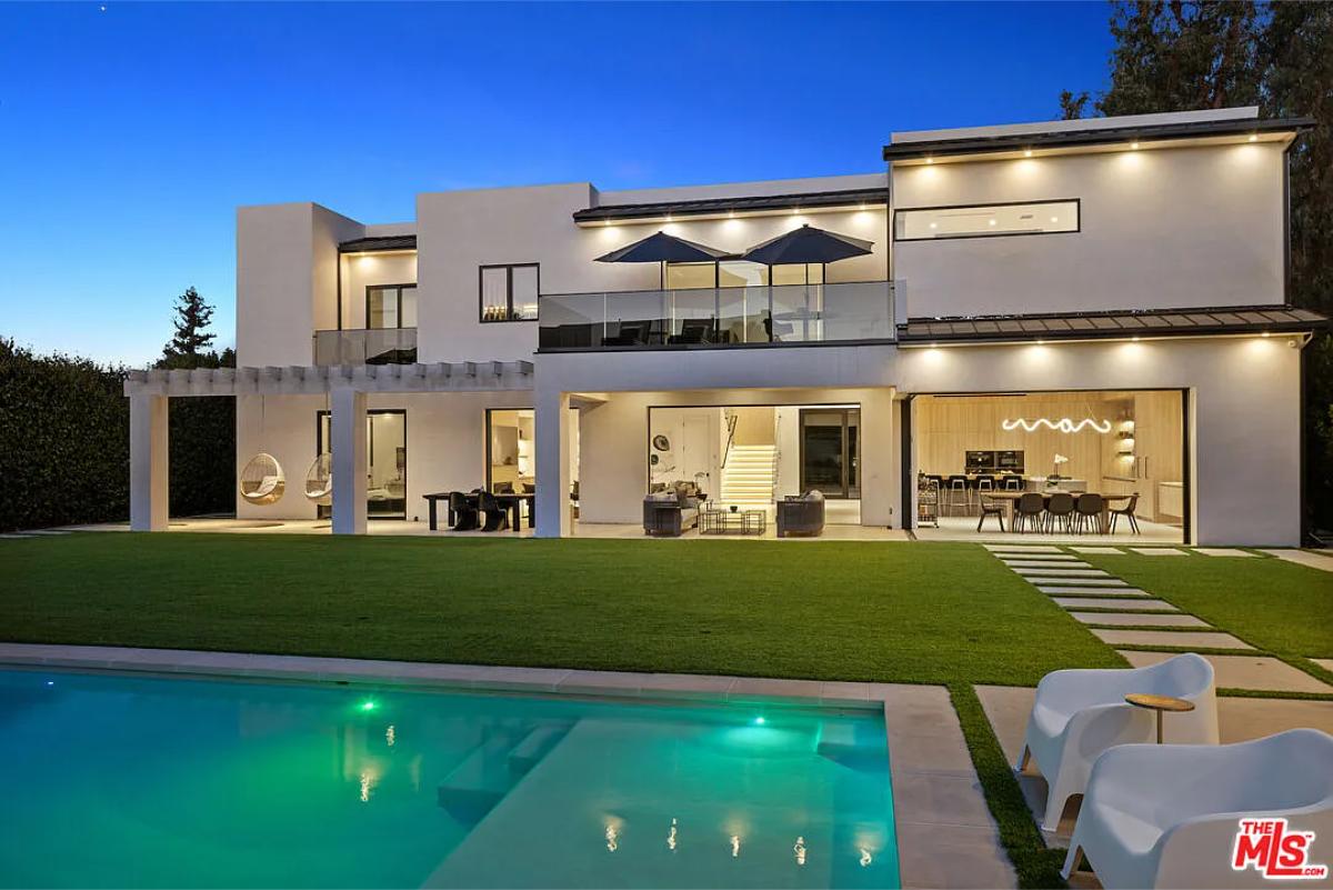 Rear view of the mansion with a pool.