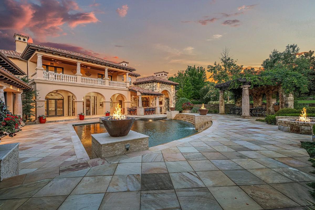 Rear view of the mansion with a pool.