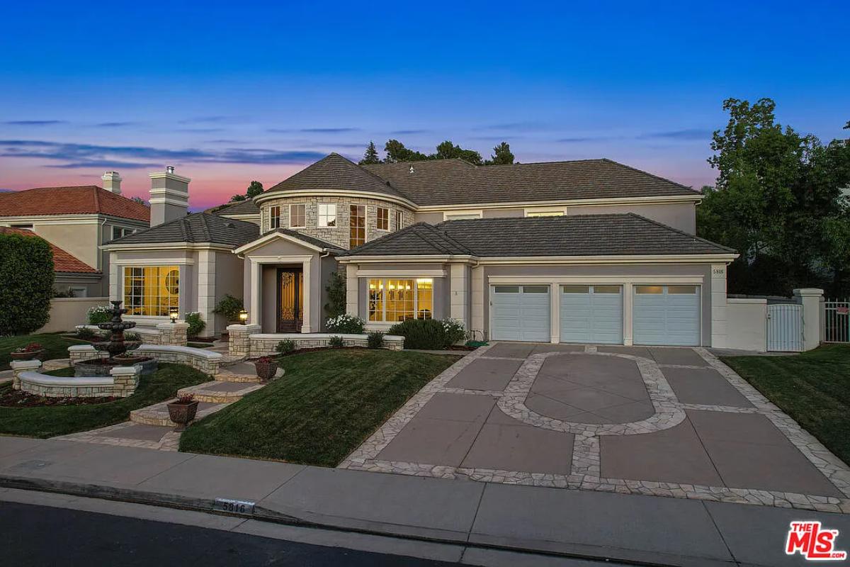 Front view of the mansion with a garage.
