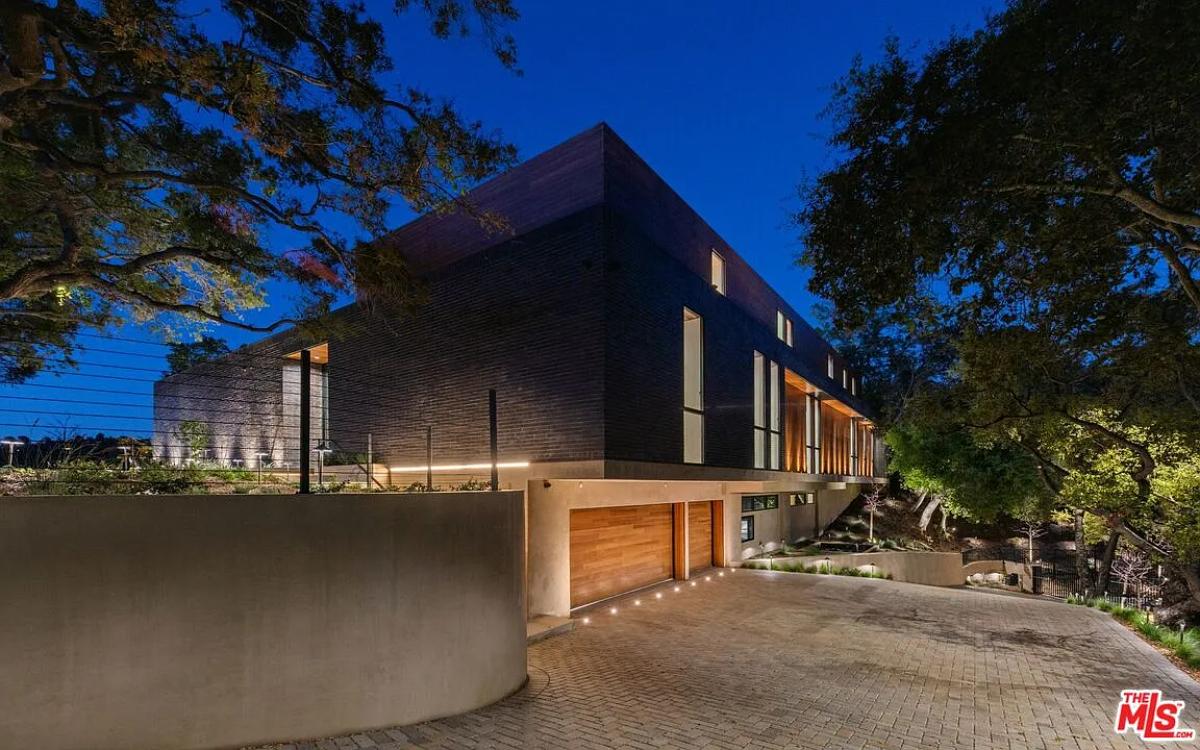 Garage with a spacious driveway.