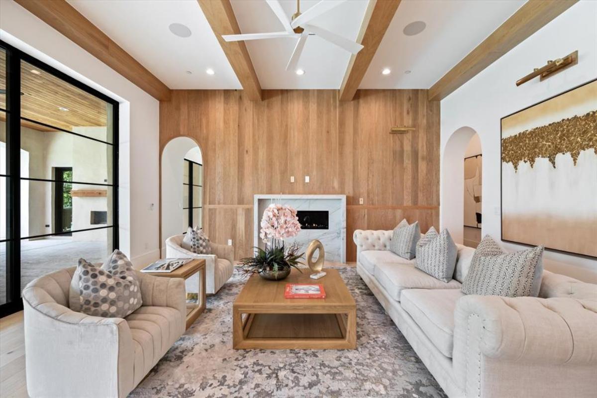 Living room with couches and a fireplace.
