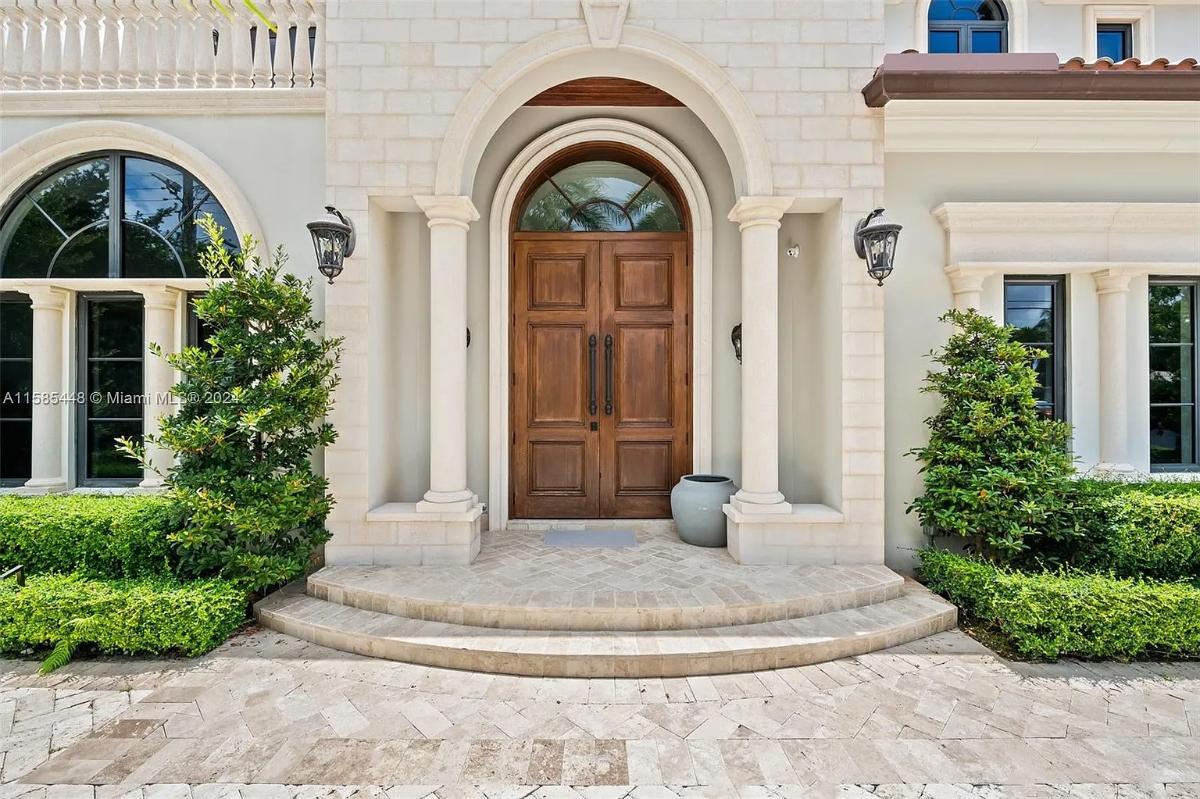 Front entry of the mansion with hardwood doors.