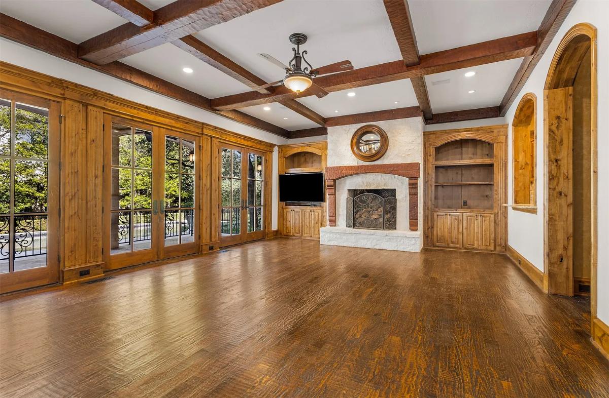 Living room with hardwood floors and a fireplace.