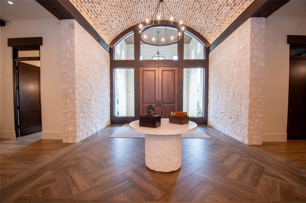 Foyer with hardwood doors.
