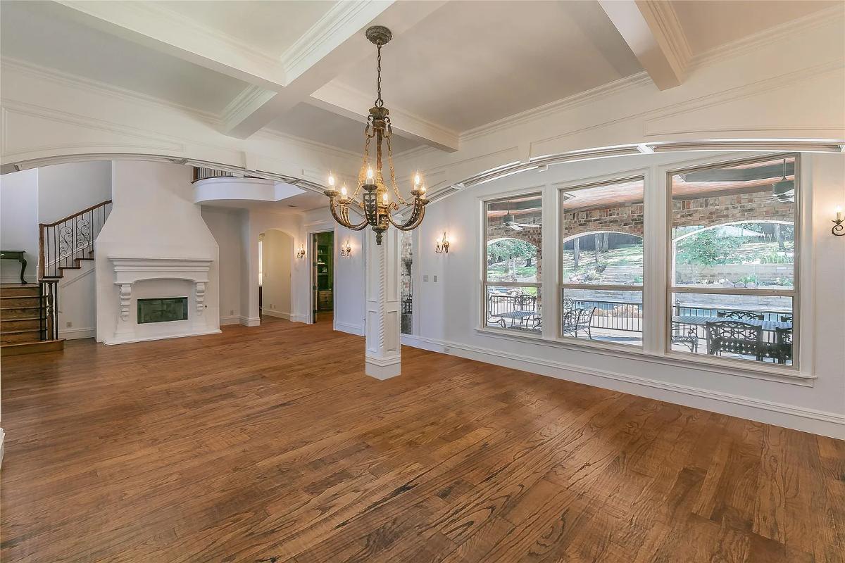 Dining room with coffered ceilings and a fireplace.