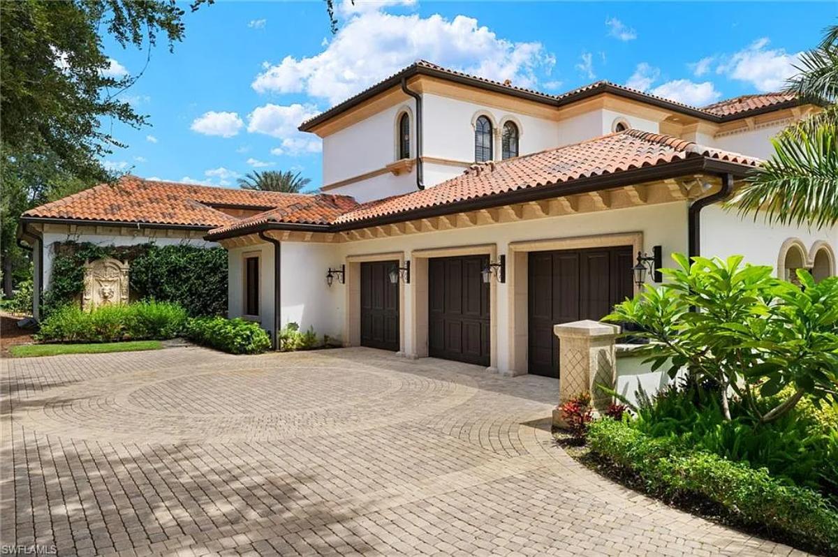 Garage with a spacious driveway.