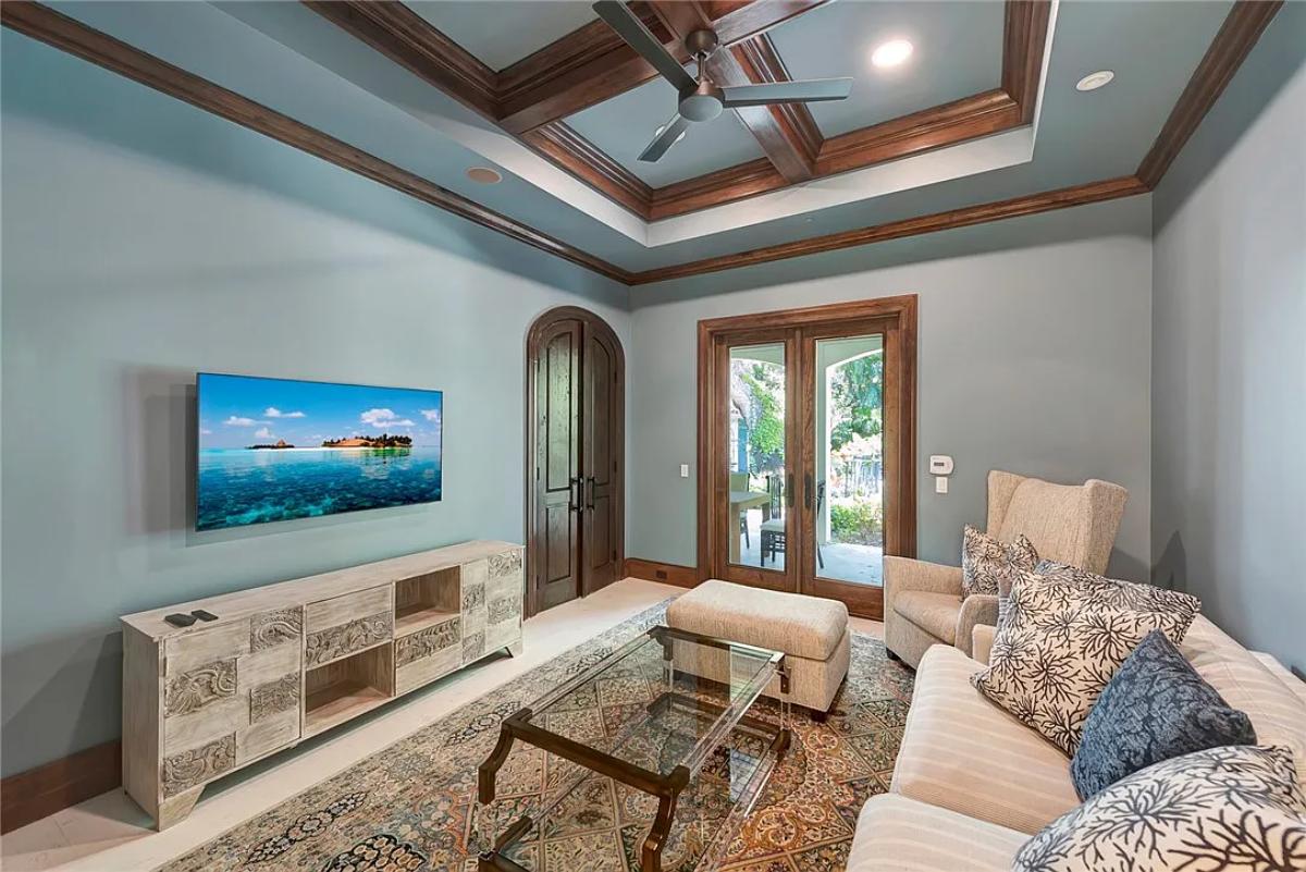 Living room with couches and a TV.
