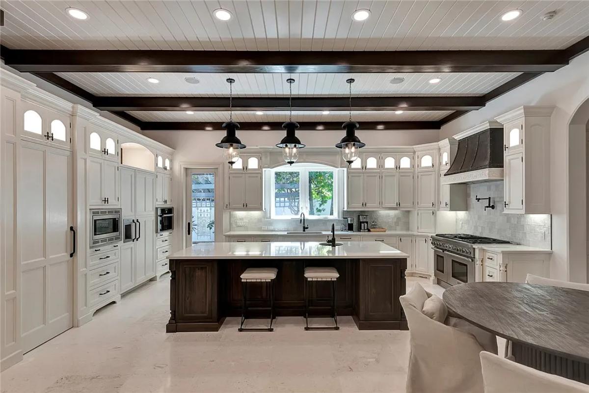 Kitchen with custom cabinetry and a center island prep area.