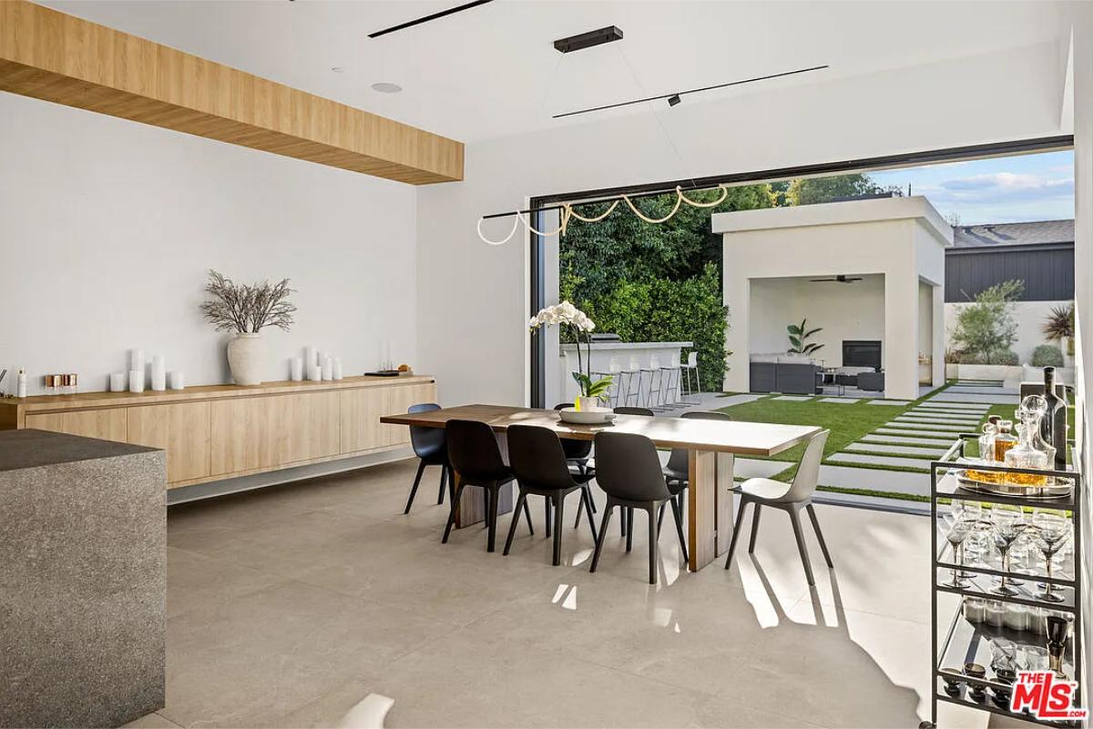 Dining room with a large wood table.
