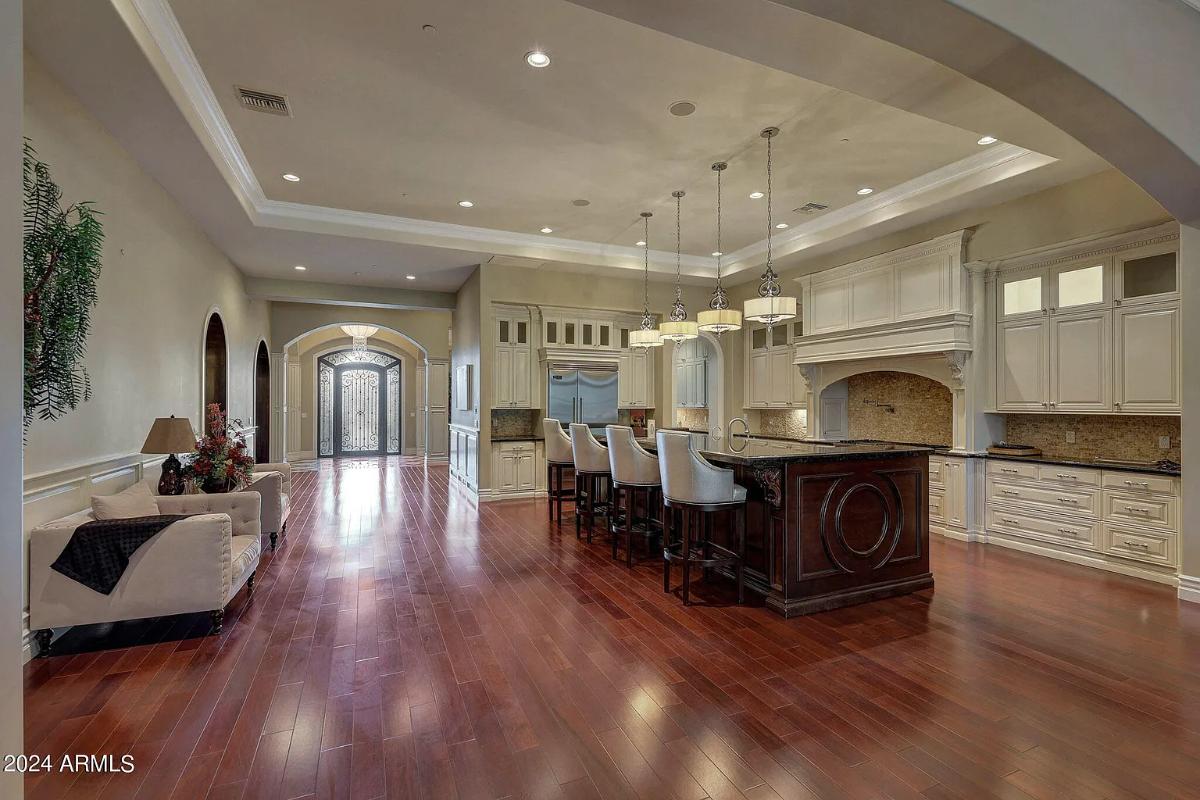 Kitchen with custom cabinetry and a counter breakfast bar.