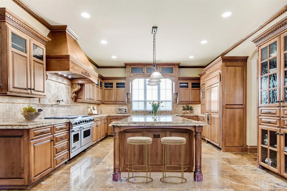 Kitchen with custom cabinetry and a center island prep area.