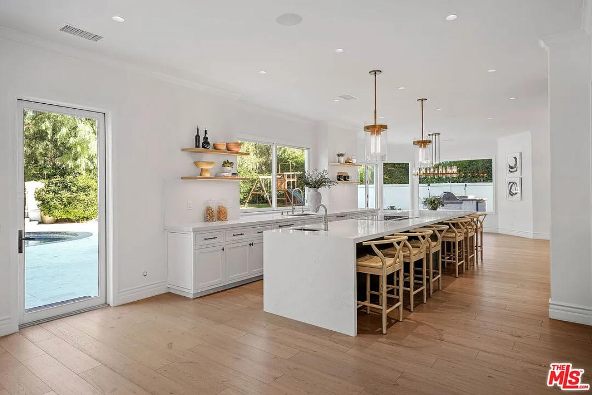 Kitchen with custom cabinetry and a counter breakfast bar.