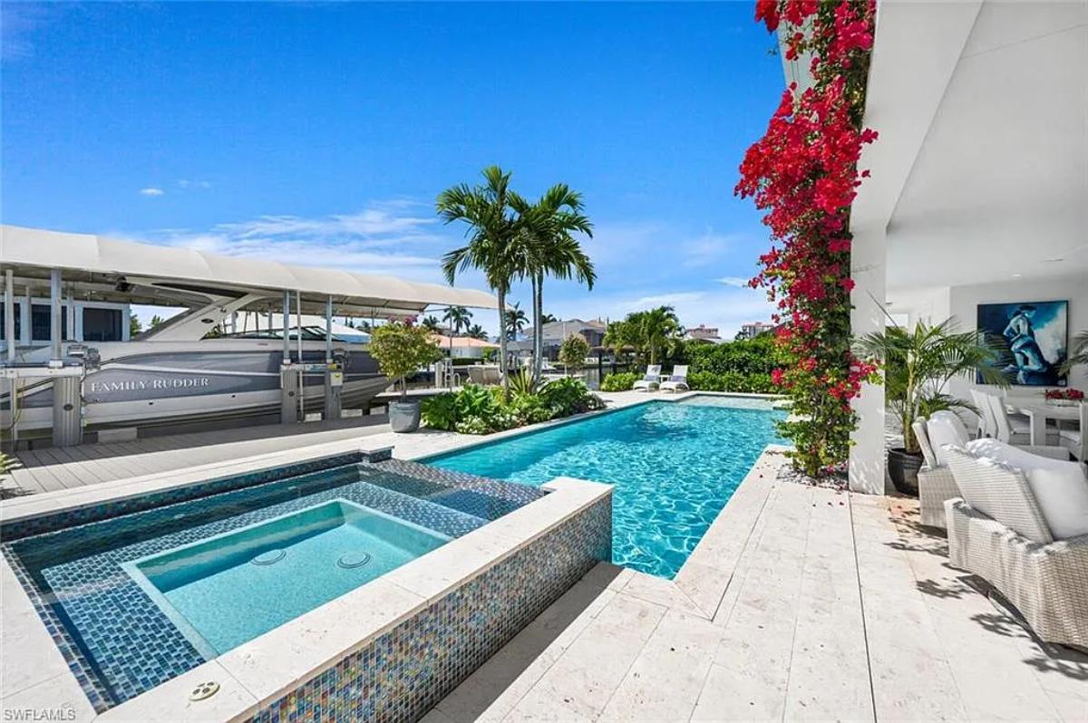 Pool with a jacuzzi.