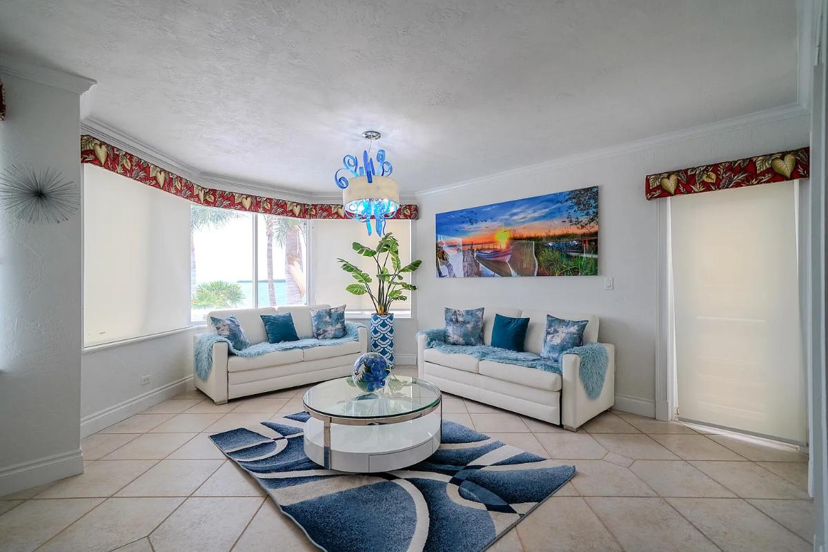 Living room with couches and glass windows
