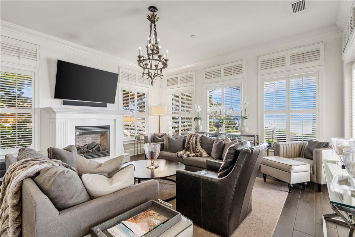 Living room with couches and a fireplace.
