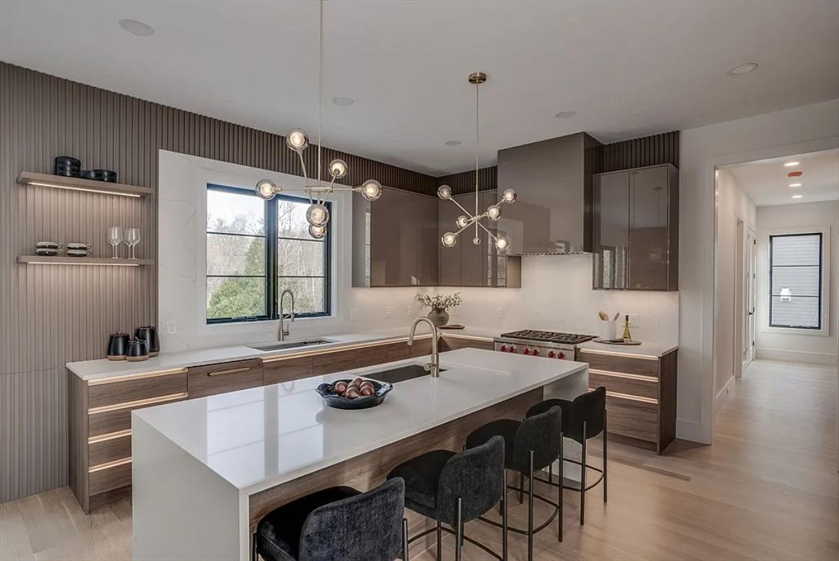 Kitchen with custom cabinetry and a counter breakfast bar.