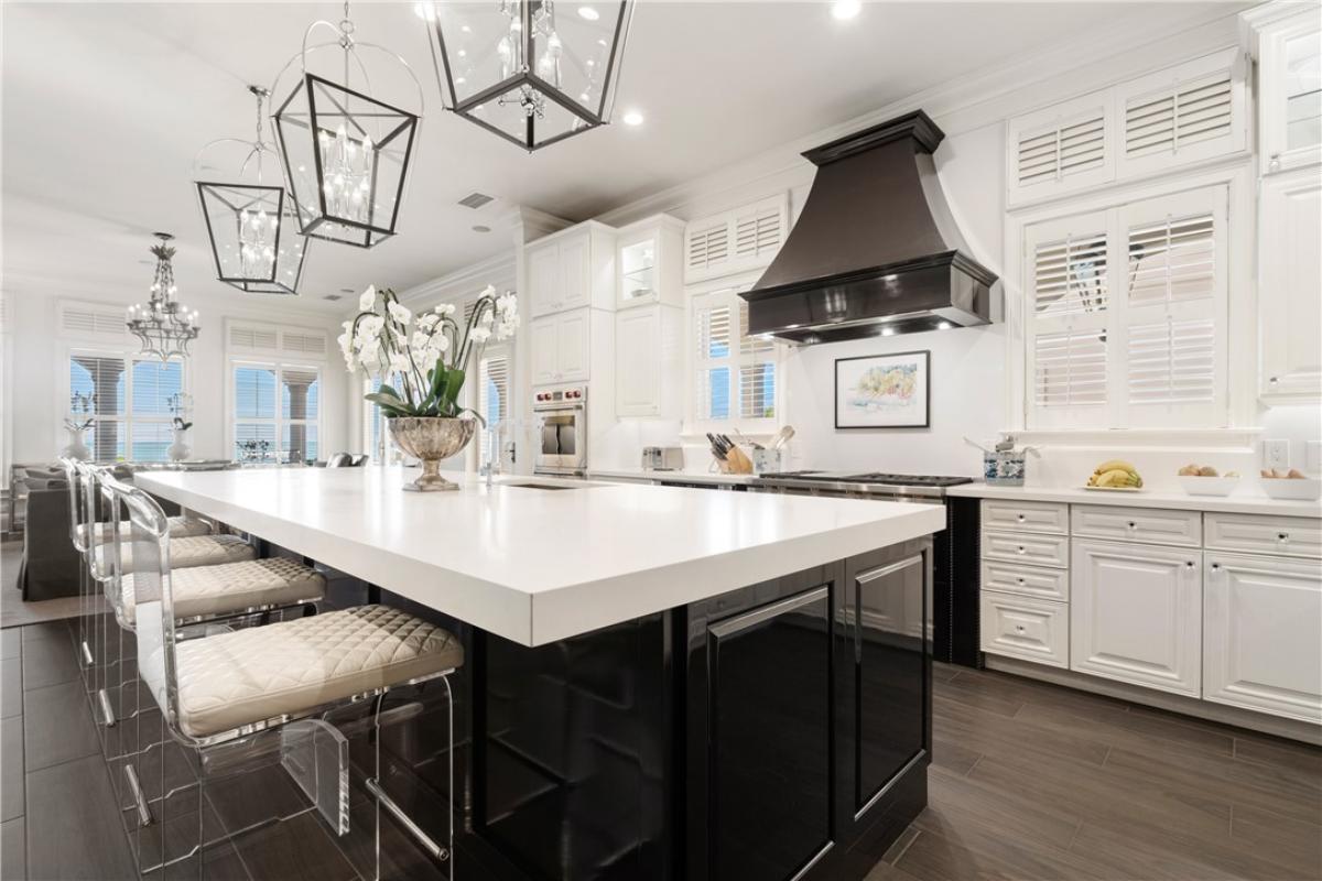 Kitchen with custom cabinetry and a counter breakfast bar.