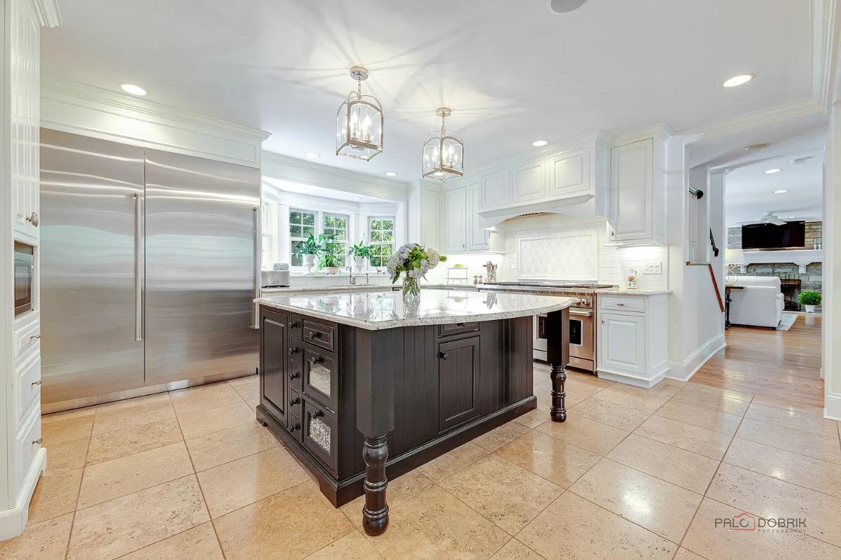 Kitchen with custom cabinetry and a center island prep area.