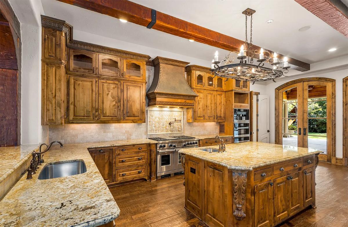 Kitchen with custom cabinetry and an island prep area.