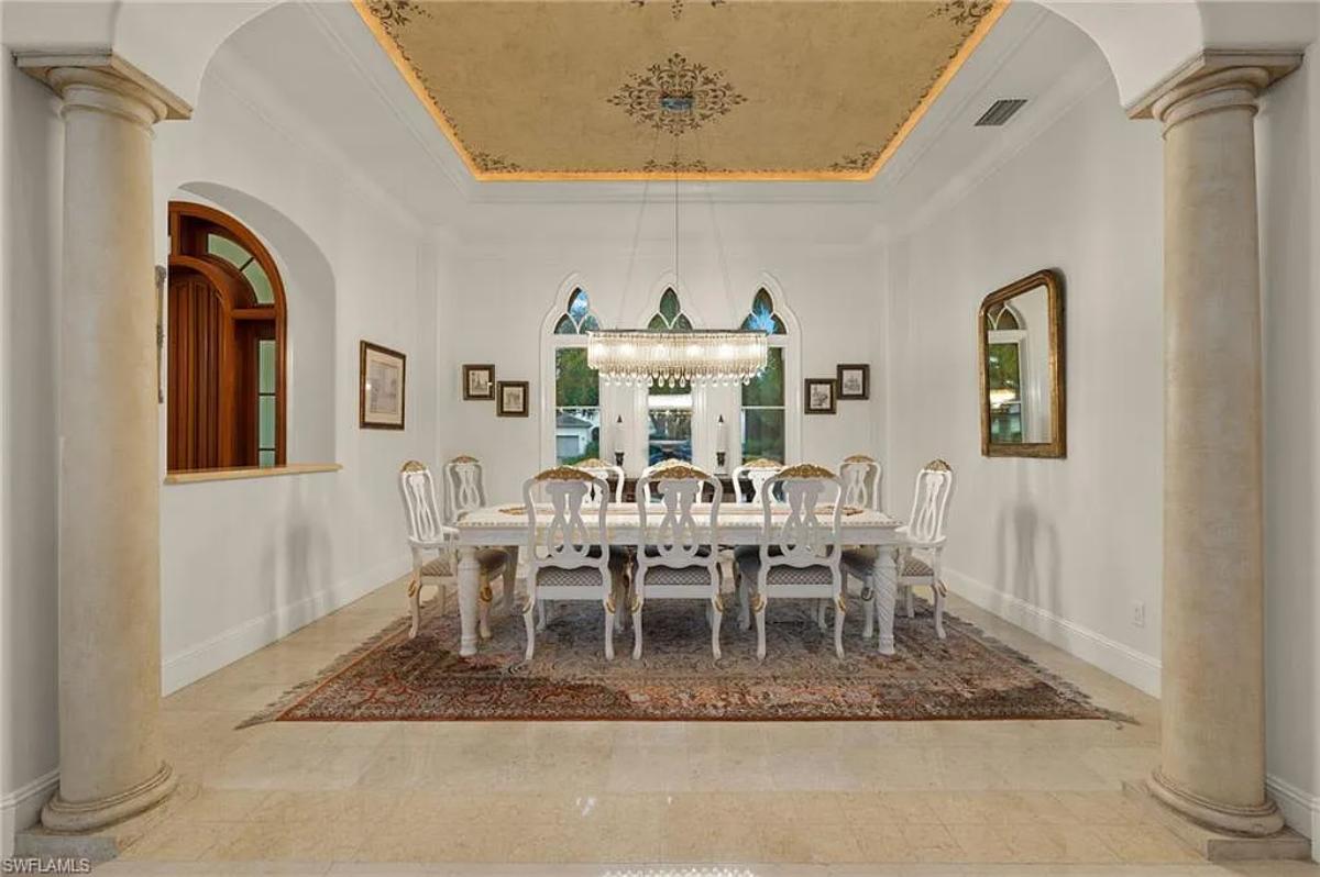Dining room with a chandelier.