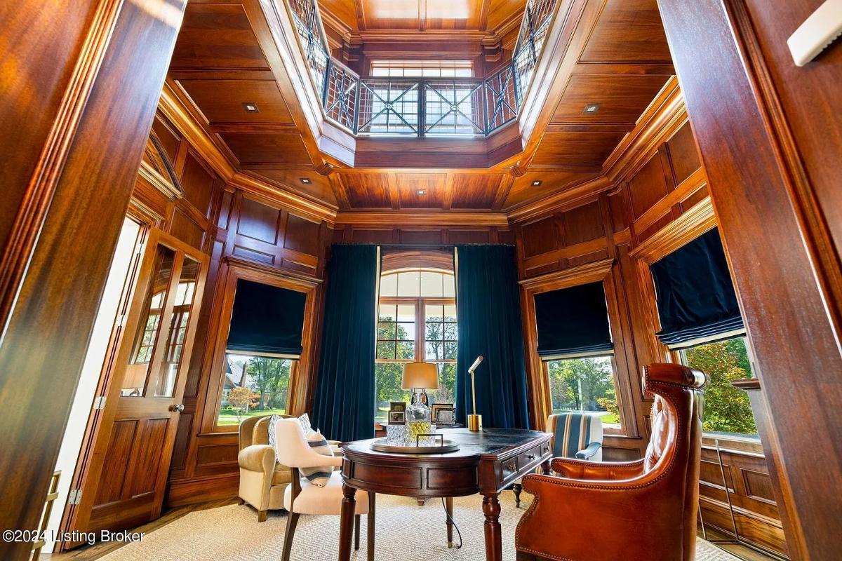 Home office with high ceilings.
