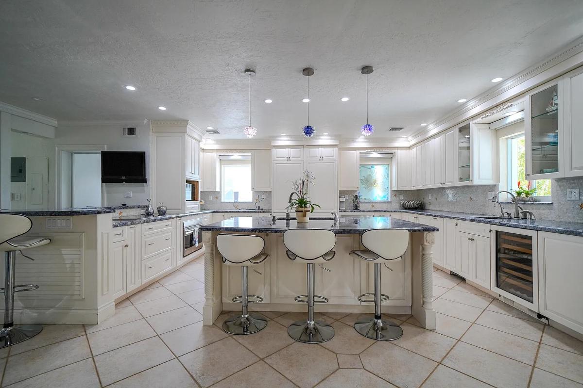 Kitchen with custom cabinetry and a counter breakfast bar.