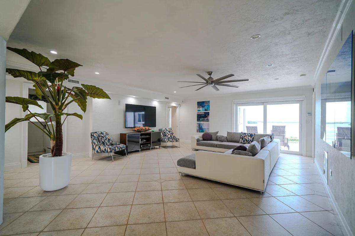 Living room with couches and sliding glass doors