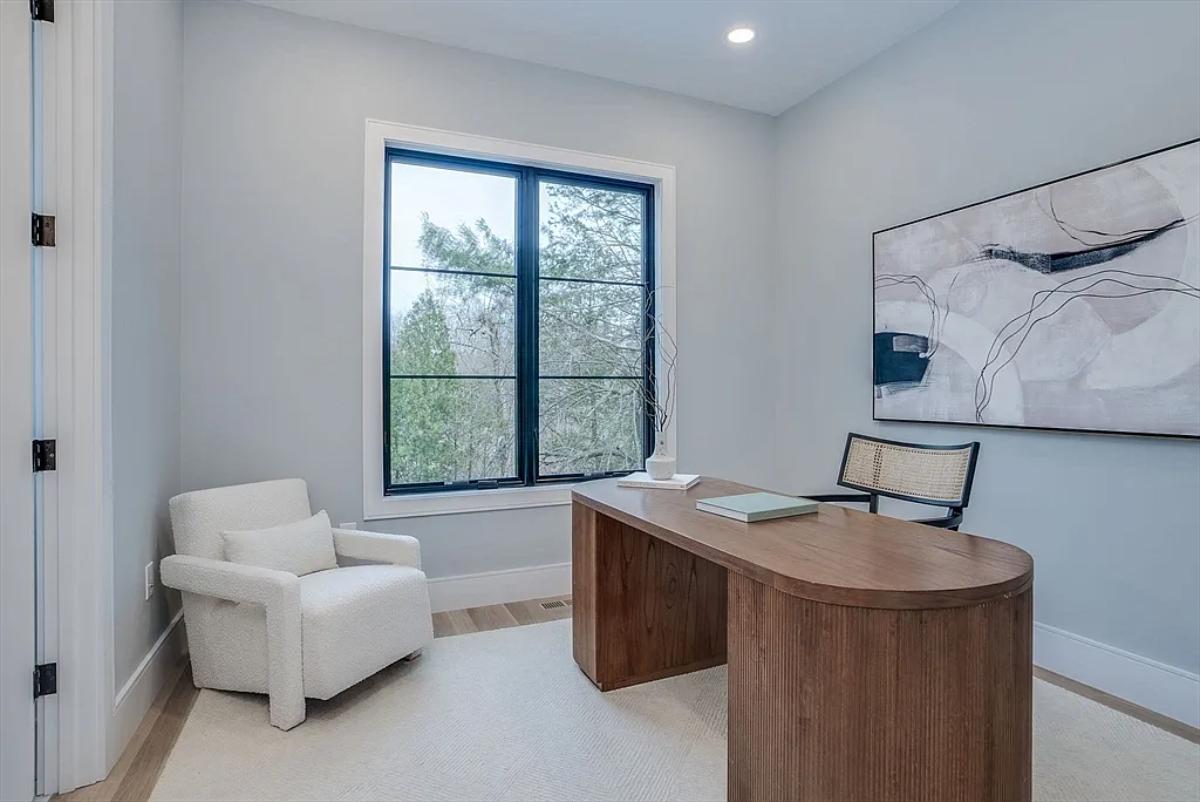 Home office with a large wood desk.