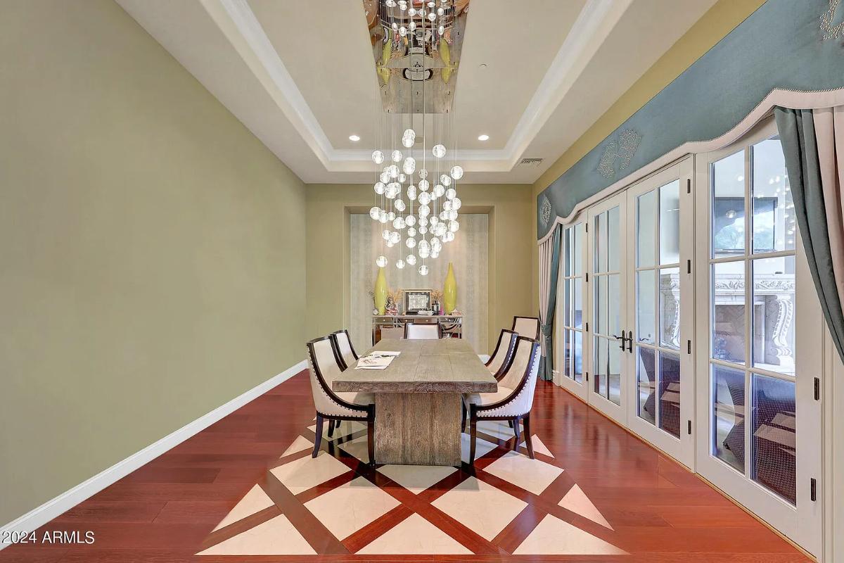 Dining room with a chandelier.