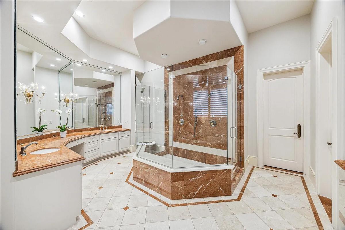 Bathroom with a custom-made vanity and a walk-in shower.