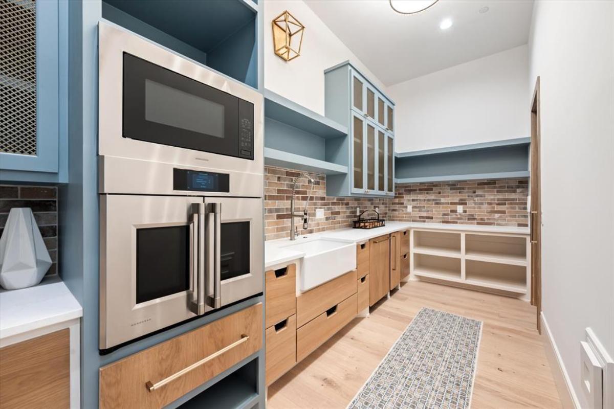 Pantry with custom cabinetry.