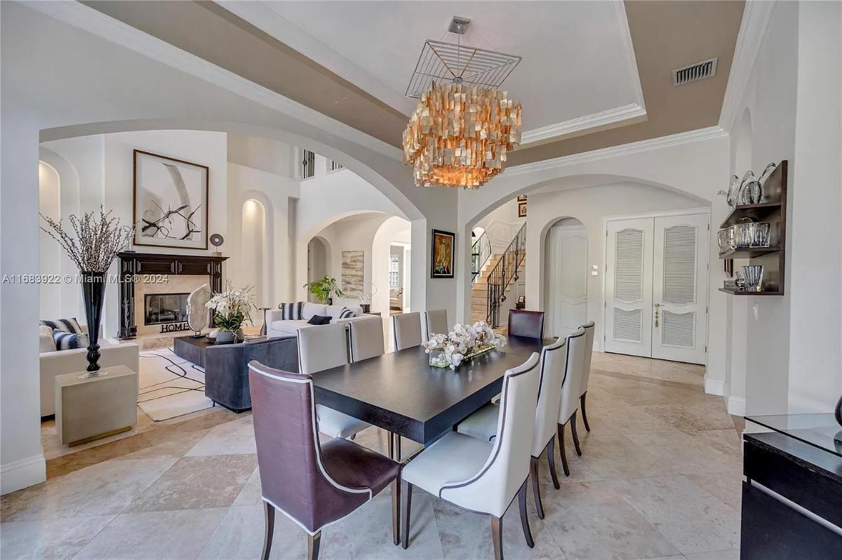 Dining room with a chandelier.