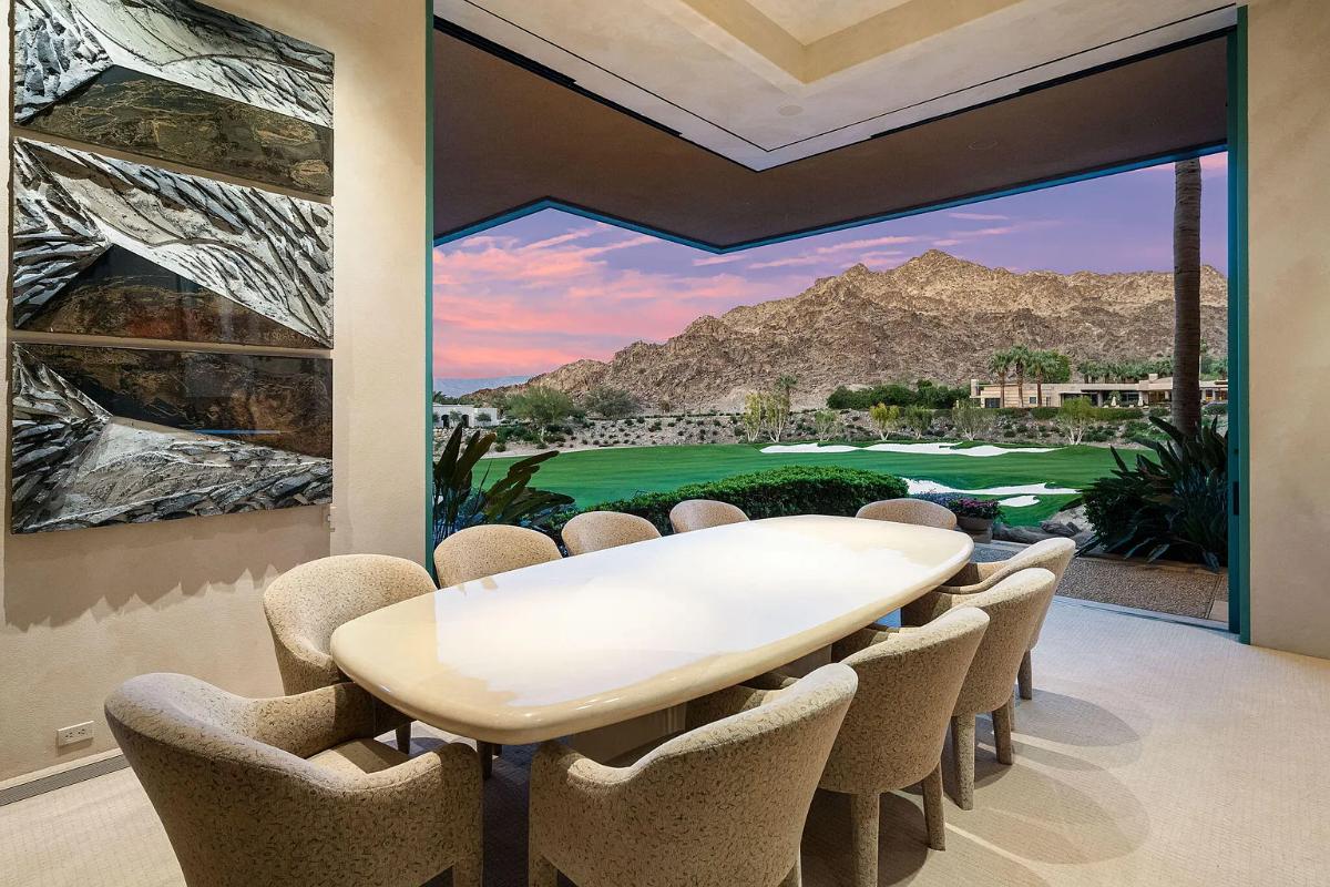 Dining room with golf course and mountain views.