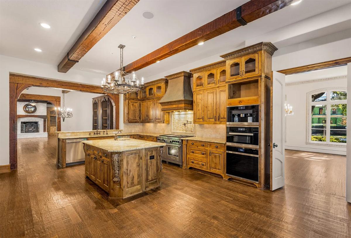 Kitchen with custom cabinetry and an island prep area.