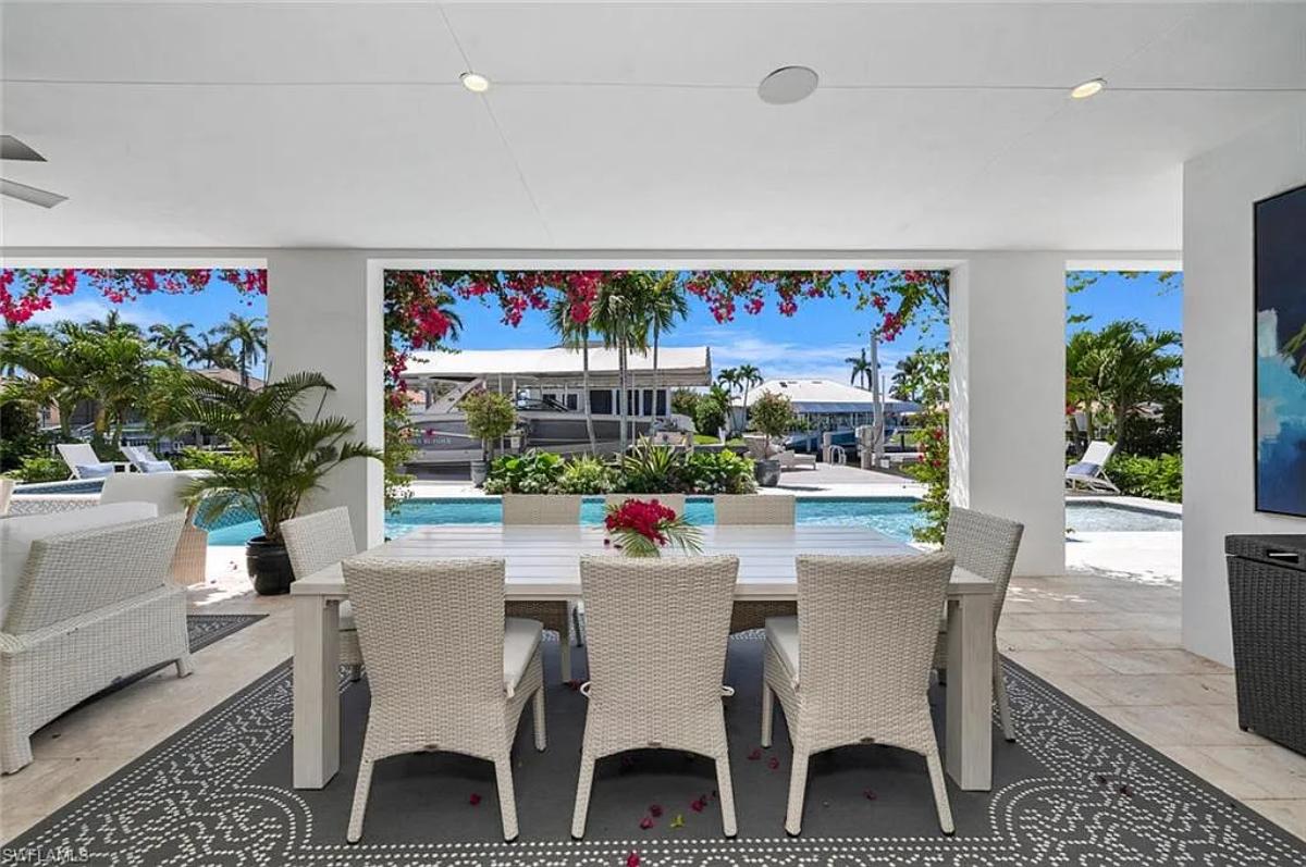 Outdoor dining area adjacent to the pool.