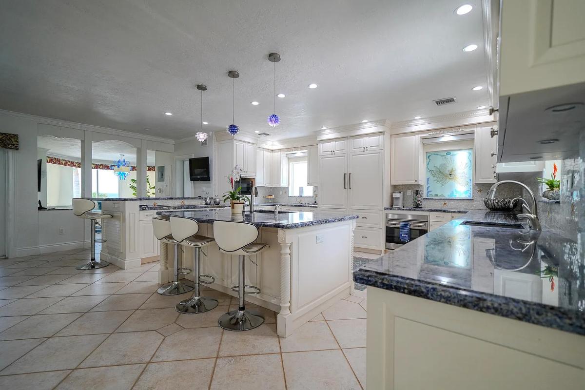 Kitchen with custom cabinetry and a counter breakfast bar.