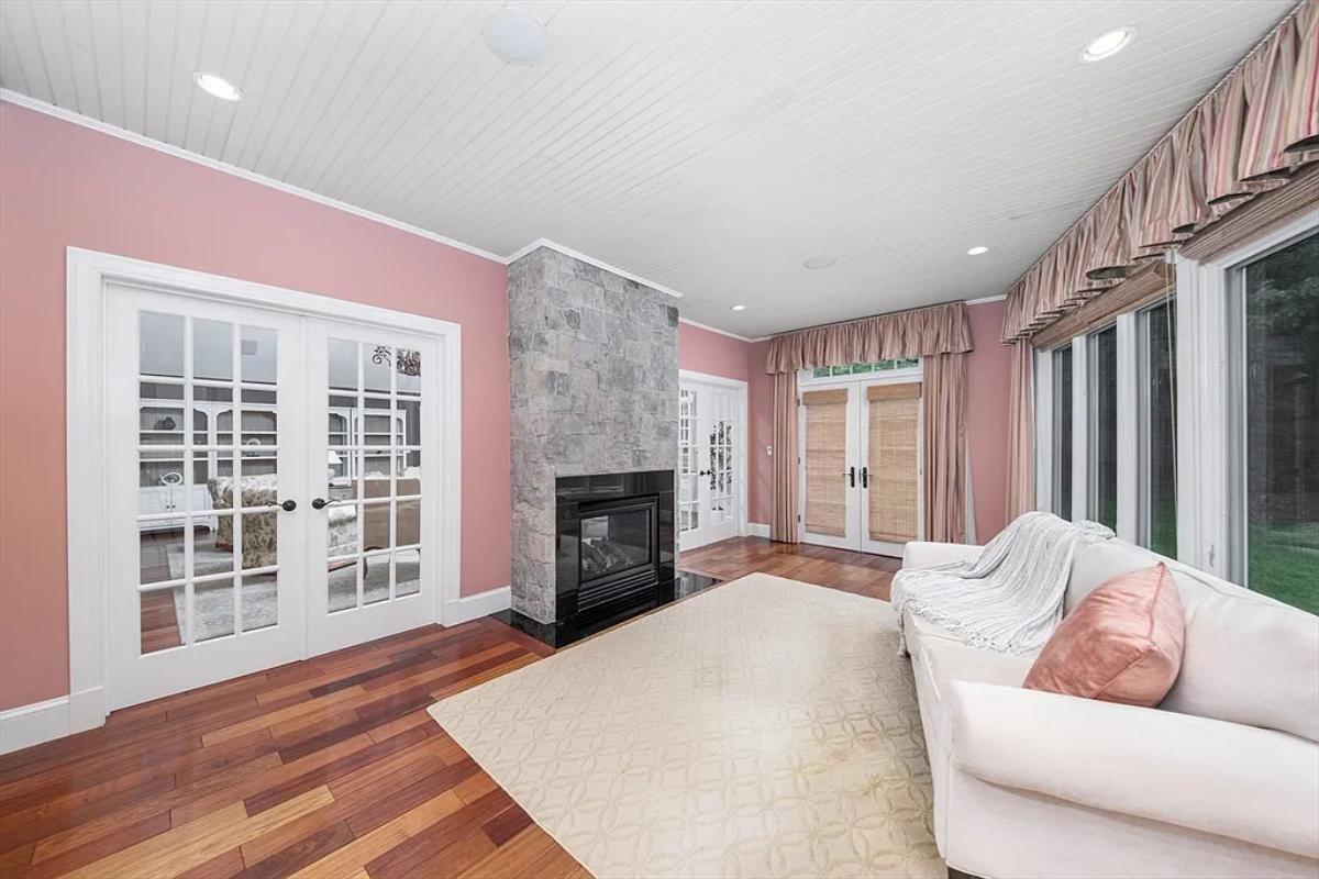 Sitting area with a couch and a fireplace.