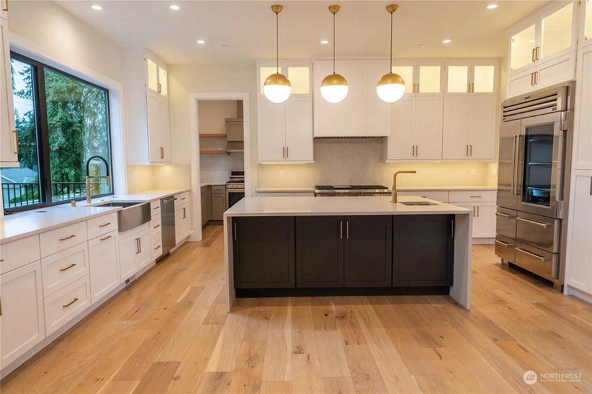 Kitchen with custom cabinetry and a center island prep area.
