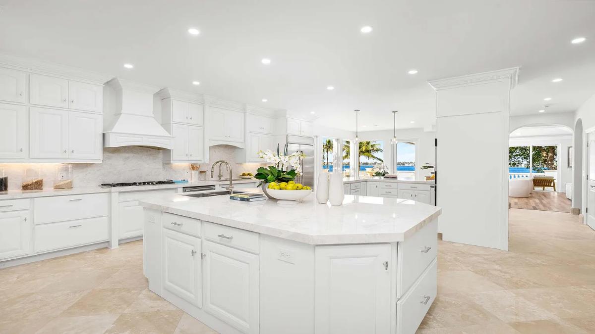 Kitchen with custom cabinetry and an island prep area.