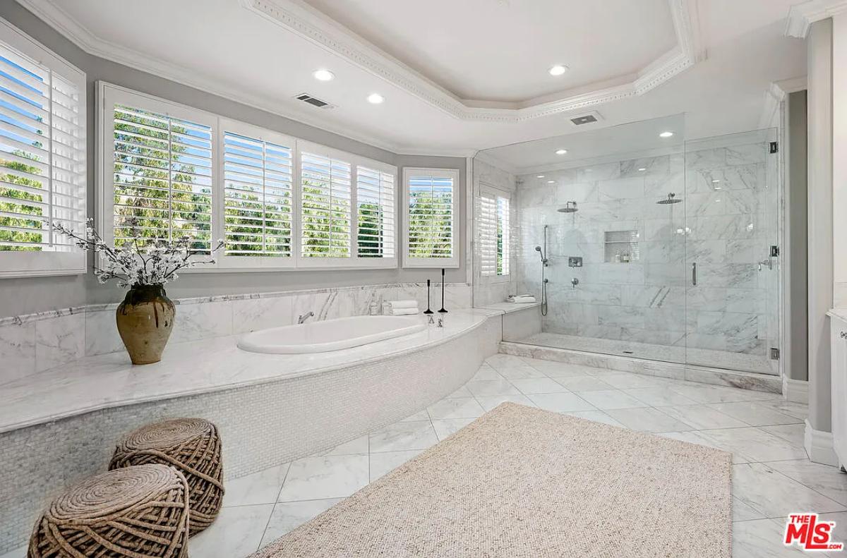 Bathroom with a soaking tub and a walk-in shower.